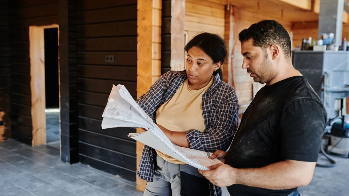 Contractor reviewing bathroom remodel plans with a Newark, NJ homeowner